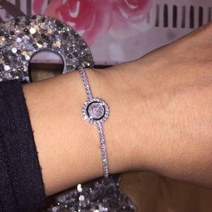 Glamorous circled silver plated ladies bracelet.